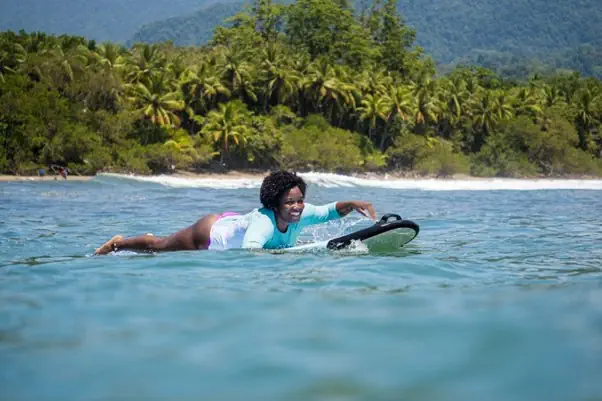 why I surf - A Bodhi Surf + Yoga student paddles a P2 Soft Longboard out to the lineup